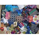 A large quantity of ladies scarves and pashminas. Approx 57 items. Together with scarf hanger.