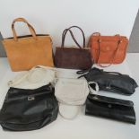 A large quantity of assorted vintage handbags and purses, some leather noted.