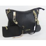 Michael Kors; black leather handbag having purse within, a/f to zip seam of internal pocket.