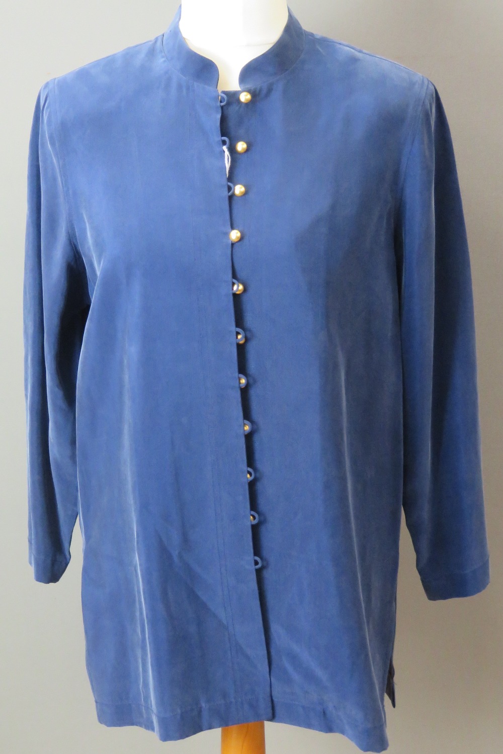 A 100% silk ladies shirt having 'gilt' buttons.