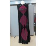 A floor length velvet cloak with hood having burgundy diamond pattern, 60" in length.