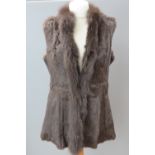 A vintage fur gilet. Approx measurements; 40" chest, 37" waist, 31" length at back inc collar.