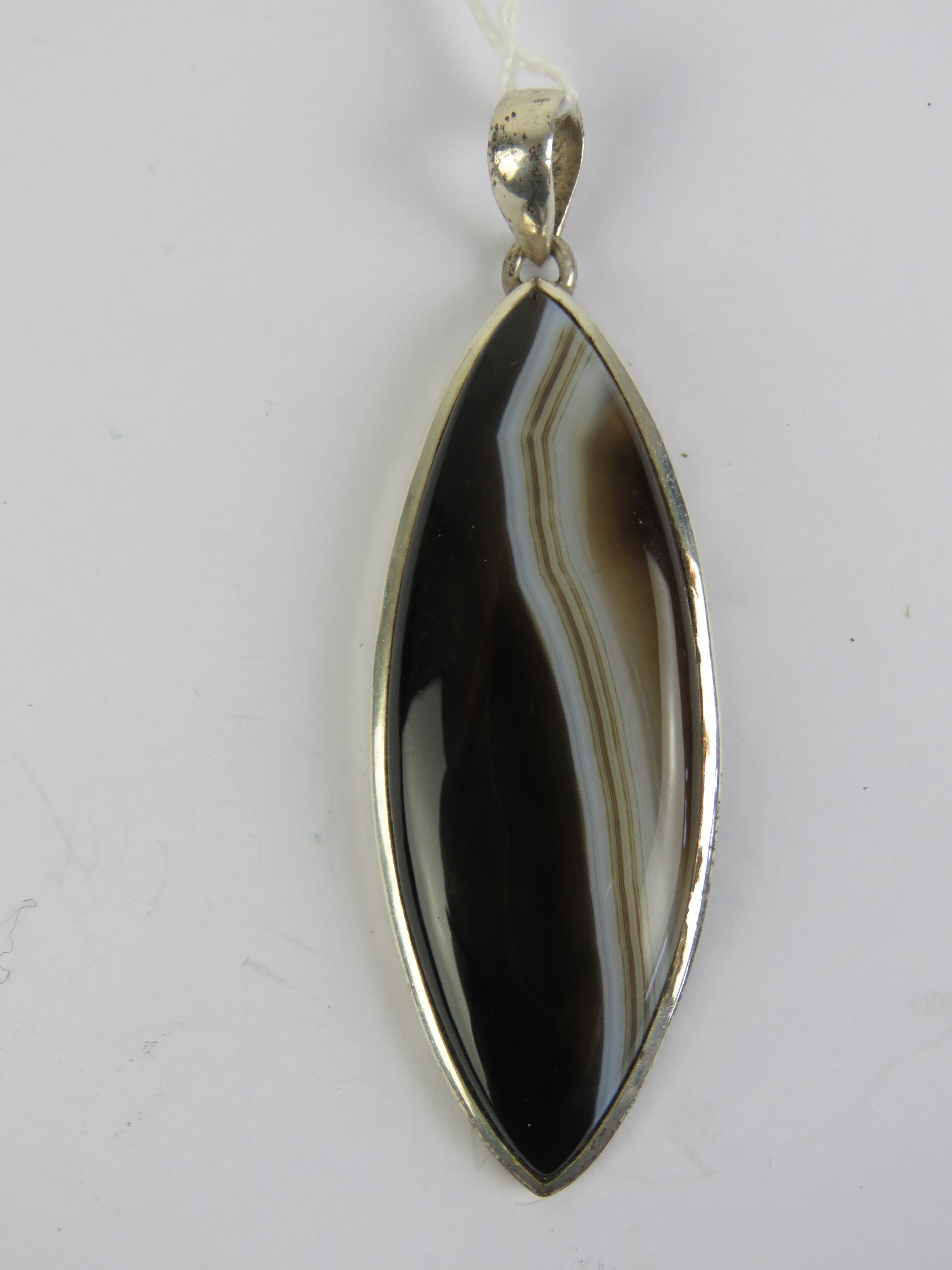 A large silver and banded agate pendant of marquise form, stamped 925, 8.3cm inc bale.