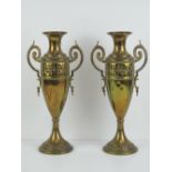A pair of Art Nouveau tall brass urn style vases each marked C & K Co Tiel Holland 1378 to base.