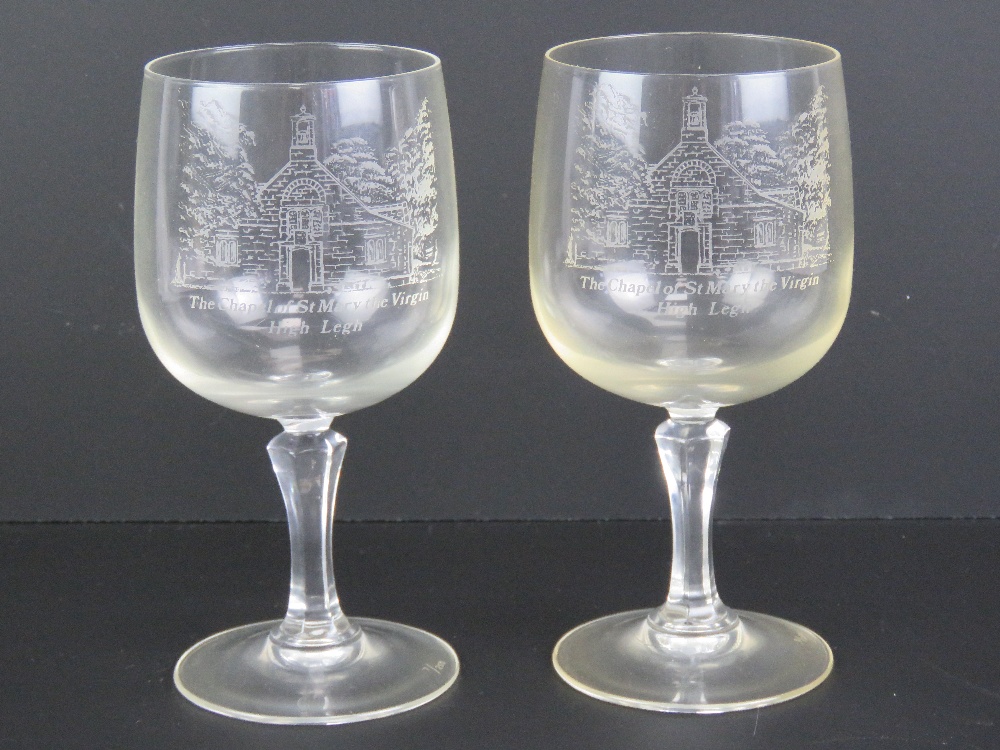 A pair of wine glasses having etched Chapel of St Mary the Virgin Highlegh upon,