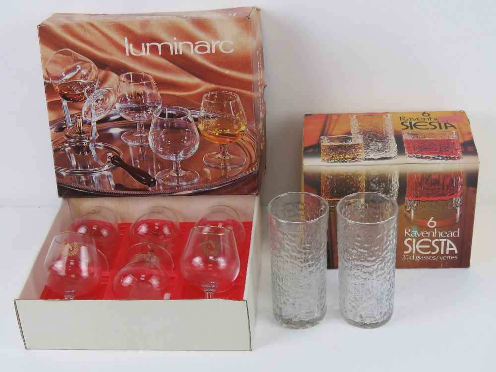 A boxed set of six Ravenhead glass tumblers, together with a set of six Luminarc brandy glasses.