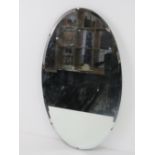 An early 20th century oval wall mirror, 56 x 33cm.