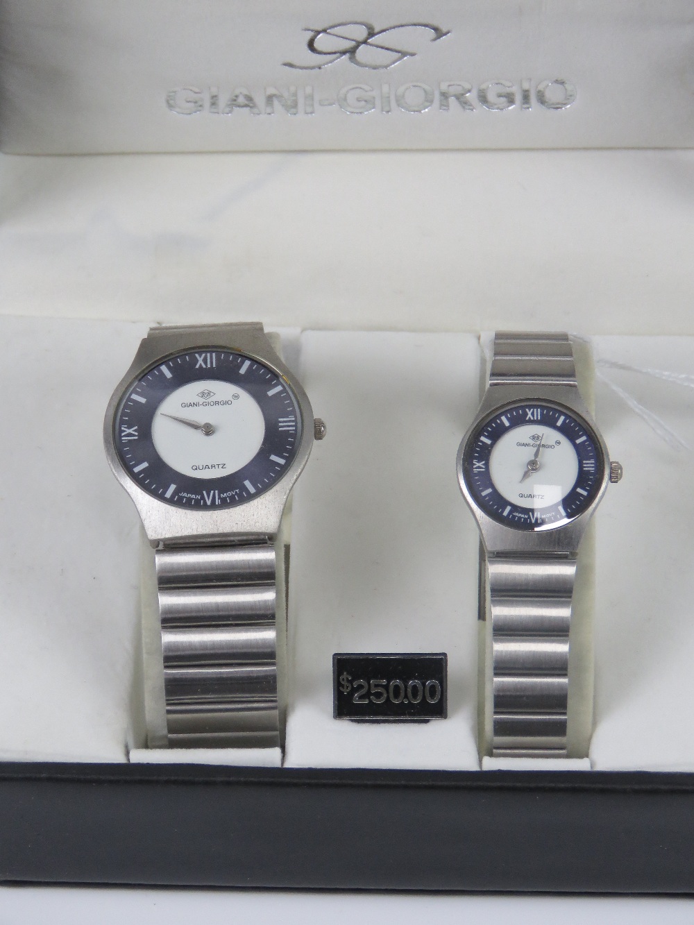 A 'His and Hers' stainless steel gents wristwatch and ladies wristwatch set, in presentation box.
