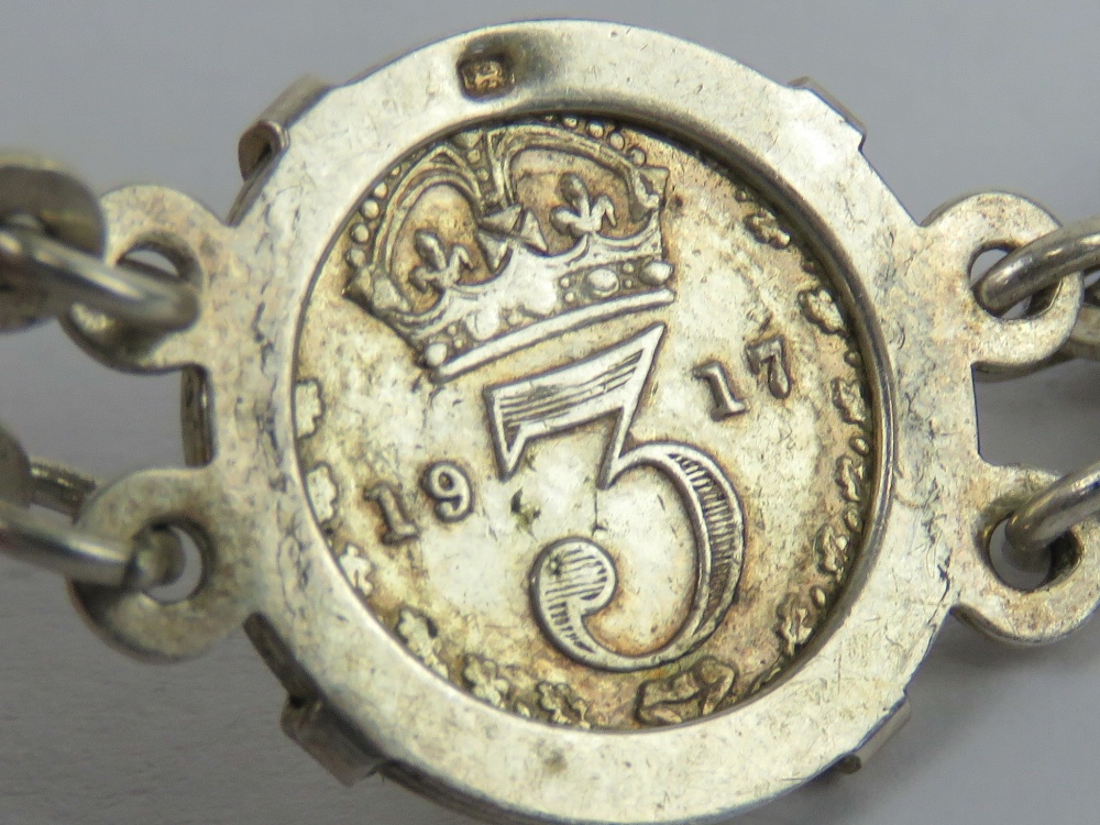 A 925 silver bracelet set with eight threepence coins 1917 - 194(0?), 19.5cm in length, 19.3g. - Image 3 of 5
