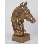 A contemporary copper coloured bust of a horse in bridle, 24.5cm high.