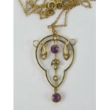 An Edwardian amethyst and pearl pendant of Art Nouveau floral style, no hallmarks,
