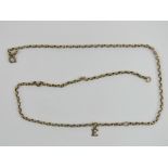 A vintage 9ct gold chain necklace with E charm upon, stamped 9c, 3.6g.