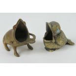 Two brass smoker's receptacles in the form of a frog and a bird.