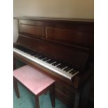 An upright piano made by Hopkinson London together with piano stool.