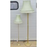 A contemporary brass stemmed standard lamp with frilled silk shade over,