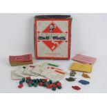 A vintage travel sized set of Monopoly having metal counters, manufactured by John Waddington Ltd,