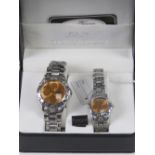 A 'His and Hers' stainless steel gents wristwatch and ladies wristwatch set, in presentation box.