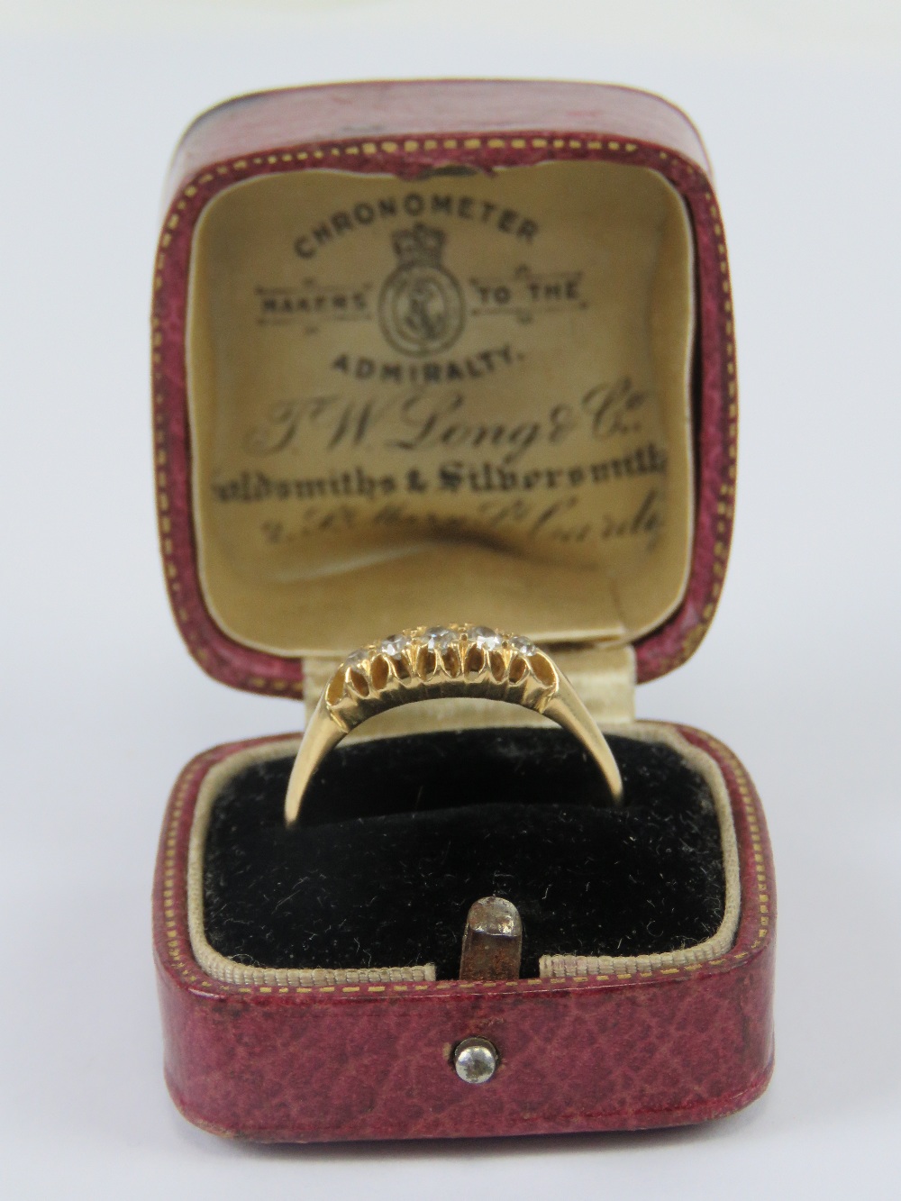 An 18ct gold diamond ring having carved head set with five graduated round cut stones, - Image 3 of 3