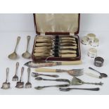 A boxed set of six silver plated fish knives and forks, together with fish servers, salad servers,