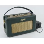 A Roberts 'Revival' radio in green leatherette, with charger.