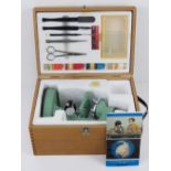 A vintage microscope set inc some lenses, tools and dyes, all within wooden box.