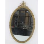 An Empire style gilt brass framed wall mirror, 52 x33cm.