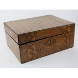A Tunbridge ware walnut veneered work box, lid lifting to reveal pin cushion etc within, 29cm wide.