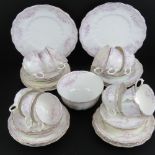 Twelve Allertons porcelain trios together with two cake plates and milk jug,