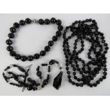 A c1920s French Jet faceted black glass bead flapper long necklace,