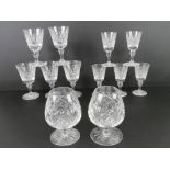 A pair of Edinburgh Crystal brandy balloons together with a matching set of five wine glasses and