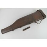 A brown leather 'leg of mutton' gun case measuring 75cm in length, leather handle a/f.