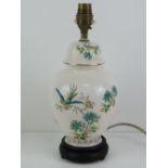 A ceramic lamp base in the style of a ginger jar with cover,