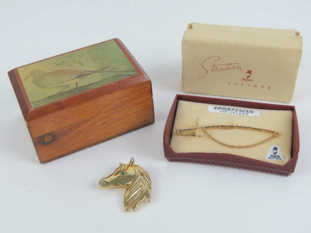 A Stratton 'Sportsman' tie holder in the form of a fishing rod, in original box.