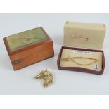 A Stratton 'Sportsman' tie holder in the form of a fishing rod, in original box.