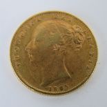 A 22ct gold 1865 Victoria sovereign, shield back, 8g.