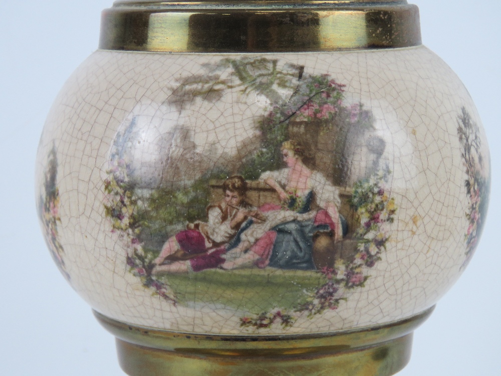 A brass oil lamp having ceramic reservoir with continental figural garden scenes upon, - Image 2 of 3