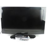 A Samsung HD Ready LCD 32" TV with remote and instruction booklet.