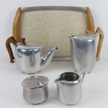 A Picquot ware tea service comprising teapot, hot water pot, milk, sugar and tray.