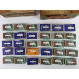 Two vintage wooden Lyons chocolate boxes containing a quantity of assorted cigarette packets with