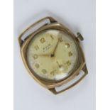 A 9ct gold Avia watch head having silvered dial with yellow metal hands and Arabic numerals,