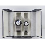 A 'His and Hers' stainless steel gents wristwatch and ladies wristwatch set, in presentation box.