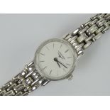 A ladies Longines wristwatch having stainless steel case with white dial and stainless steel