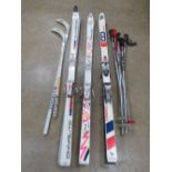 A quantity of 1970s vintage skiing gear including three pairs of Non Cava skis, two pairs of poles.