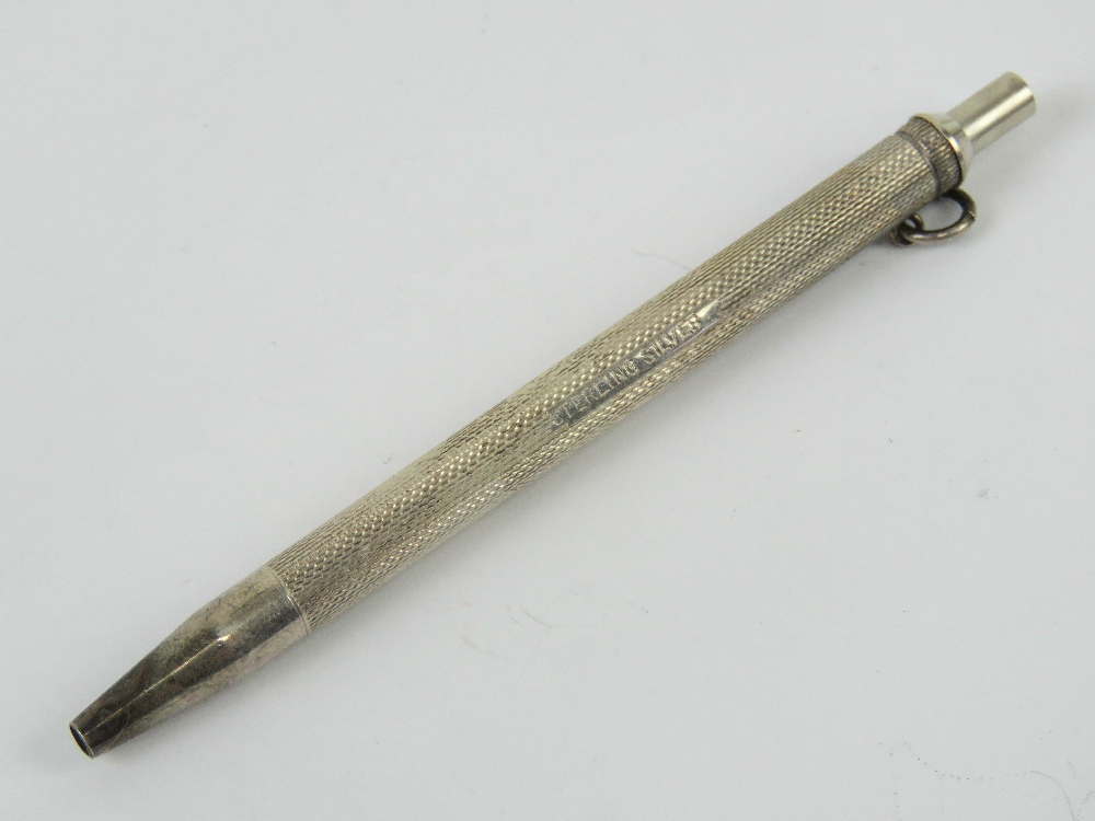 A Sterling silver chatelaine pen, having push top and being unengraved,