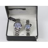 A 'His and Hers' stainless steel gents wristwatch and ladies wristwatch set, in presentation box.