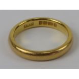 A 22ct gold D shaped band, hallmarked London, size M, 5.6g.