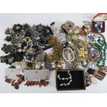A quantity of costume jewellery including cut steel flower, malachite bead necklace and bangle,