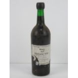 A 1963 Warre port, in unopened condition, label a/f.