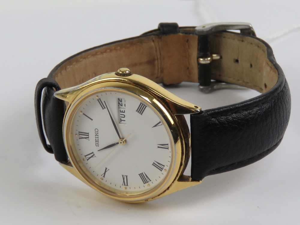 A Seiko quartz wristwatch having white dial with date and date apertures, on black leather strap. - Image 4 of 4