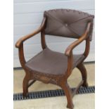 A c1930s low seat calimnos type chair, upholstered in brown leatherette.